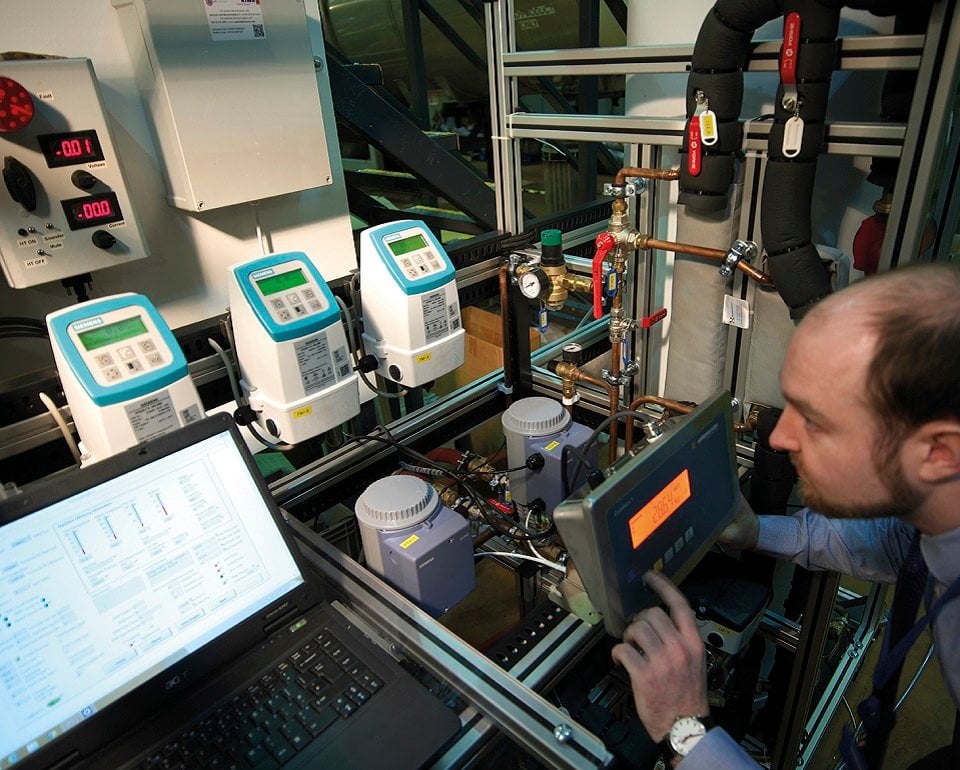 Employee conducting a heat pump test in a controled facility