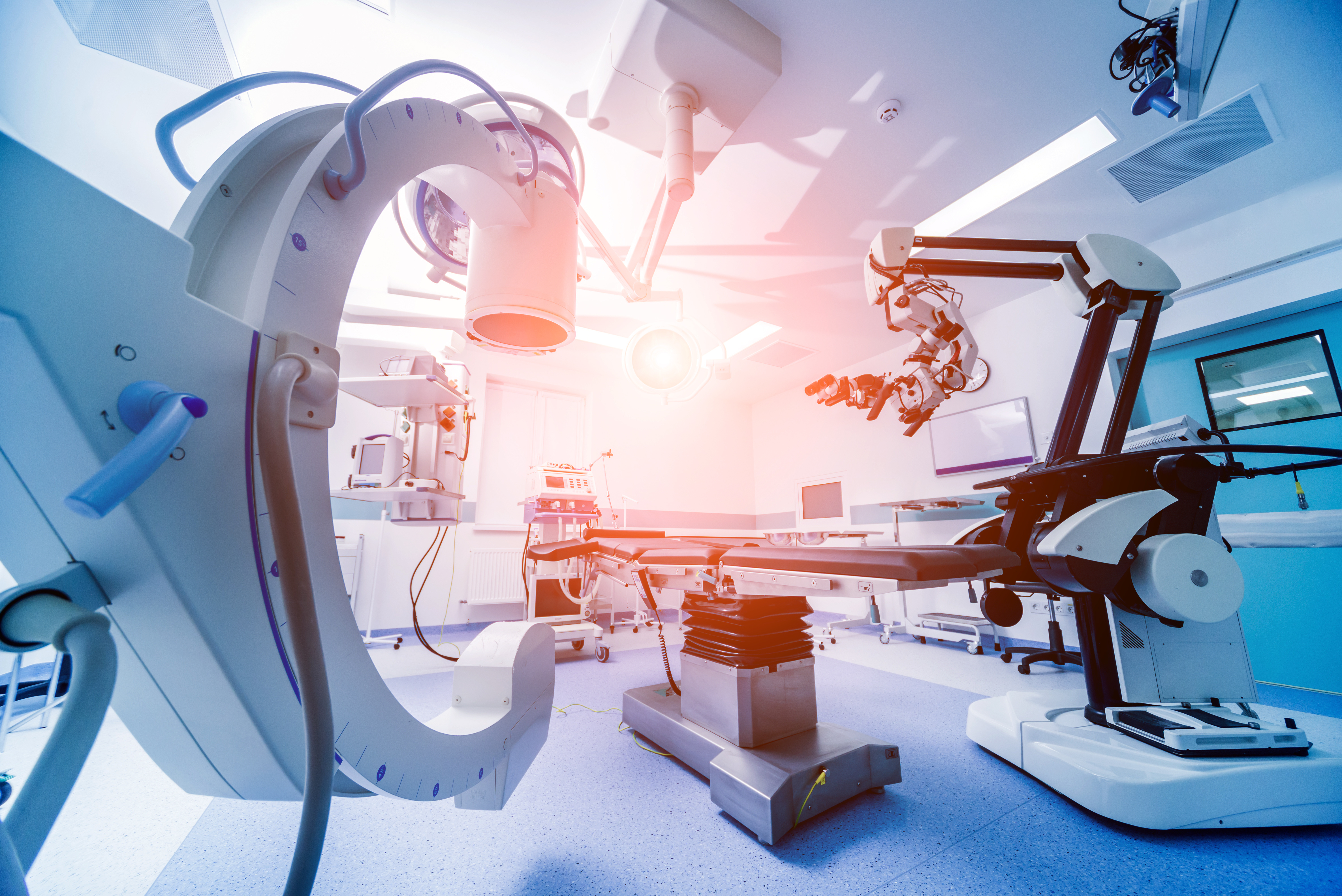 Modern operating room with advanced medical equipment and surgical robotics, showcasing cutting-edge technology in healthcare