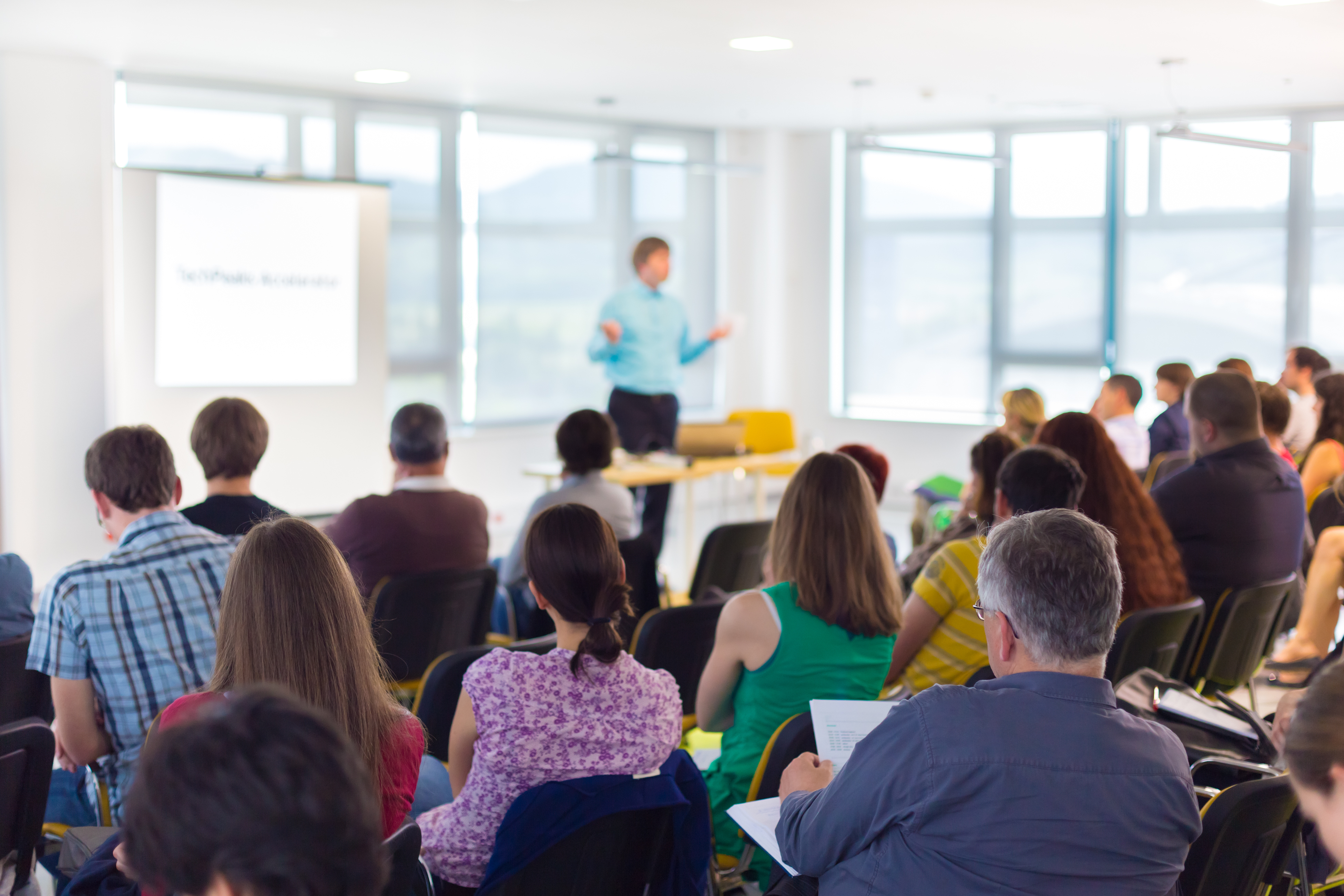 Group of people listening to a training course
