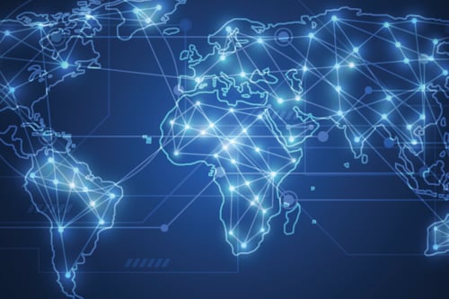 Glowing blue digital world map with connectivity lines and nodes, illustrating global network communication and technology