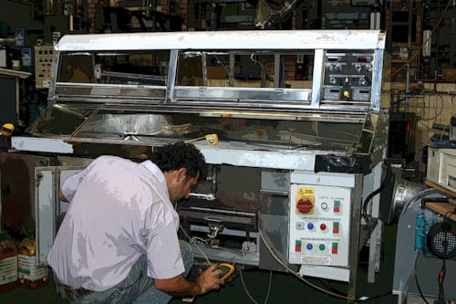 Employee testing a catering equipment