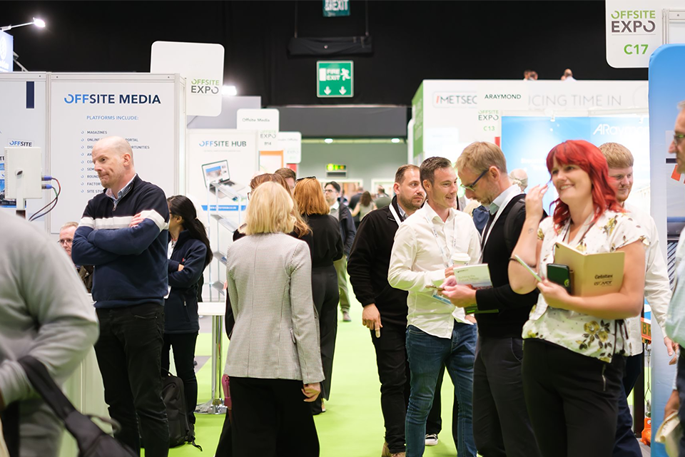 people wandering an exhibition hall